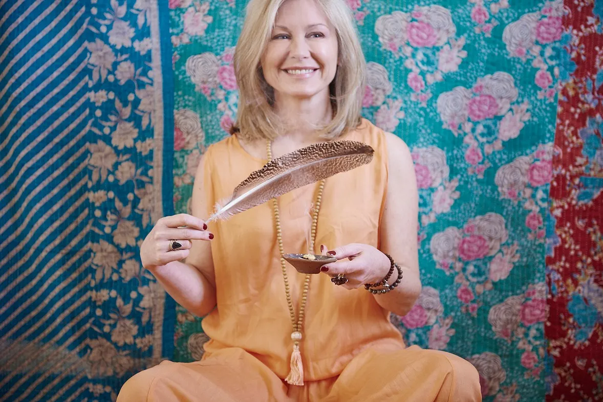 Melinda van Nispen with feather - spiritual mentor